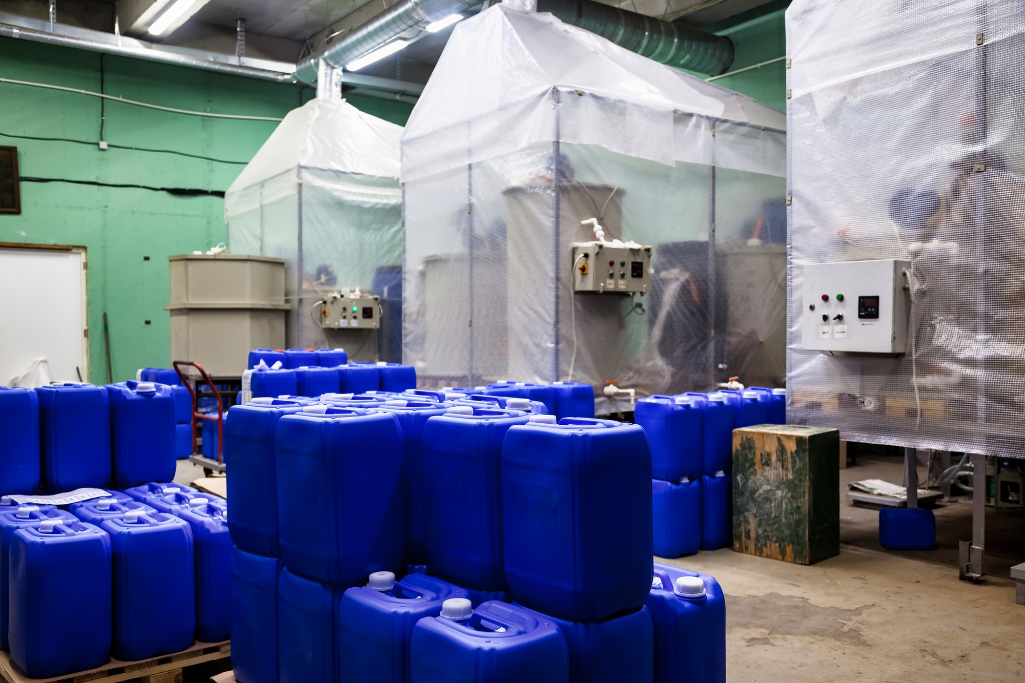 Interior of industry chemical warehouse storage of liquids on pallets