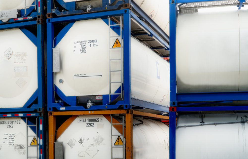 Chemical tank container. ISO tank container for chemical delivery. Bulk liquid transport. Chemical